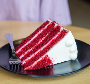 SLICE OF DOUBLE LAYER RED VELVET CAKE